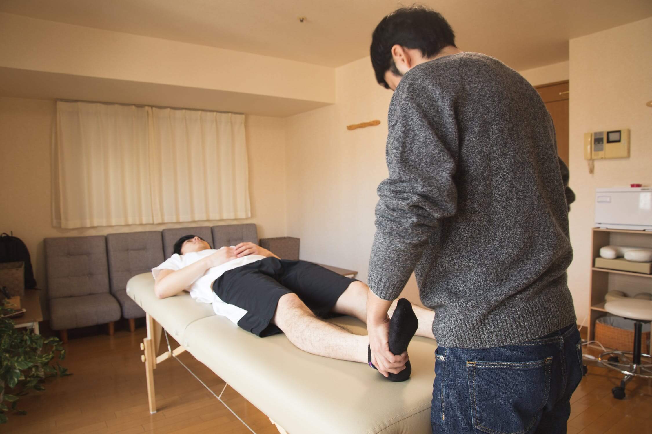 A physiotherapist doing in-home physiotherapy
