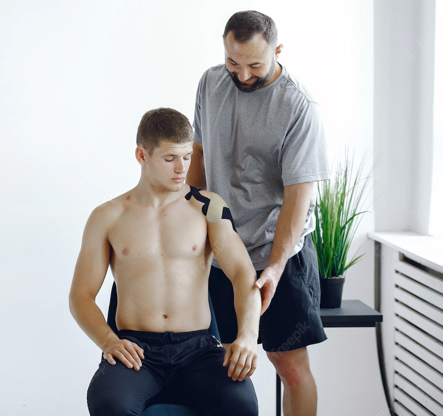 A physiotherapist treating a man
