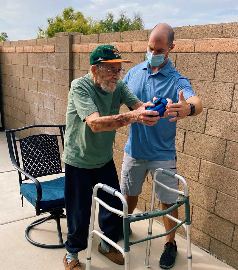 A aged man learning to walk with the help of Rumy